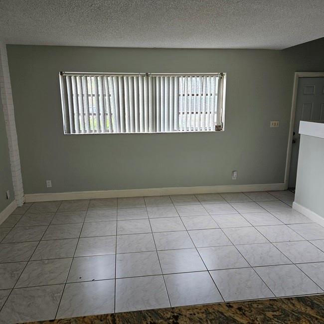 3270 North Pine Island Road, Unit 307 Sunrise, FL 33351 - Photo 7 of 17 a view of an empty room with a window