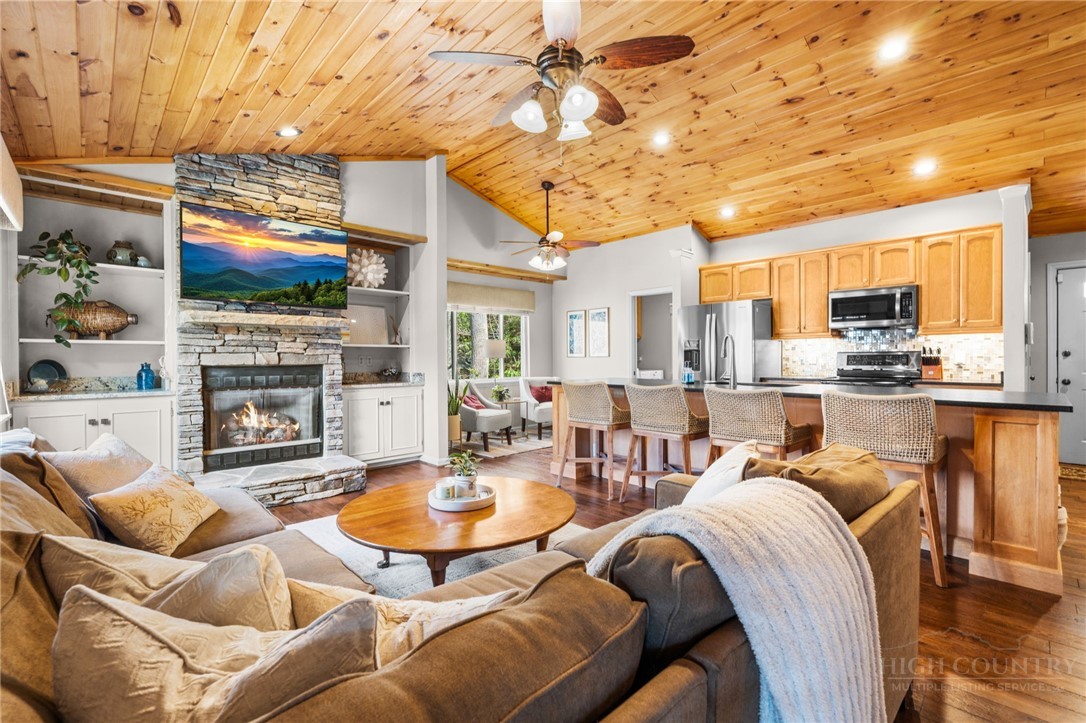 220 Woodwinds Lane Seven Devils, NC 28604 - Photo 2 of 46 a outdoor space with furniture and a fireplace
