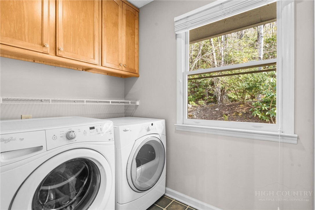 220 Woodwinds Lane Seven Devils, NC 28604 - Photo 25 of 46 a view of washer and dryer next to window