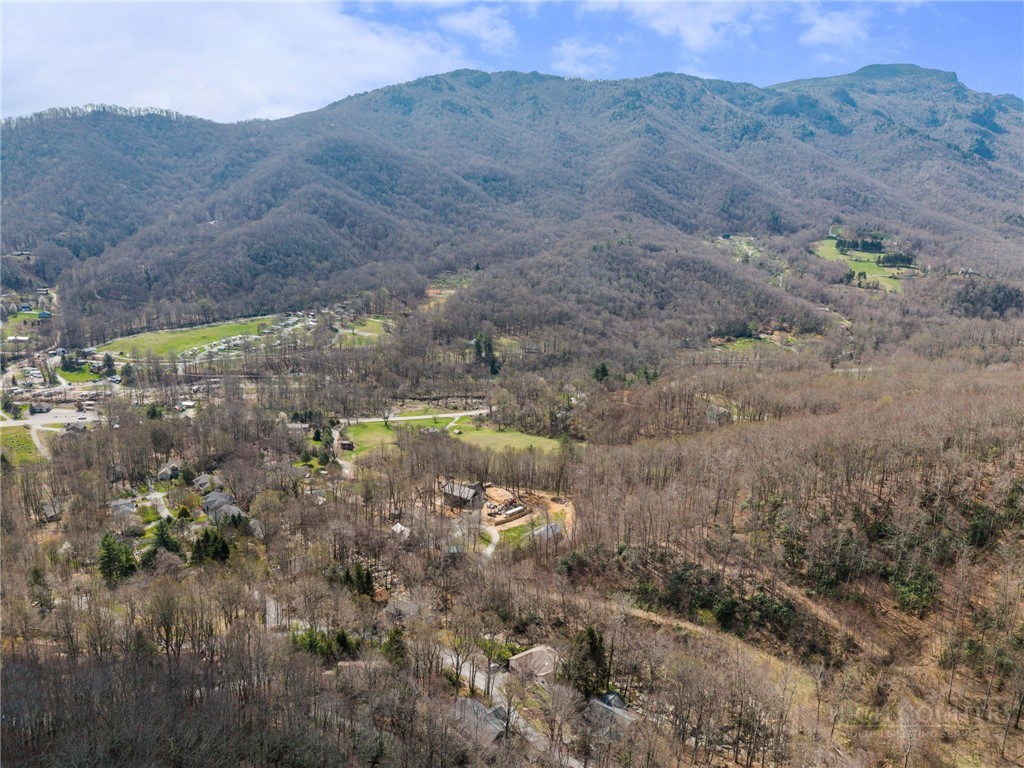 220 Woodwinds Lane Seven Devils, NC 28604 - Photo 41 of 46 a view of a lake with mountains in the background