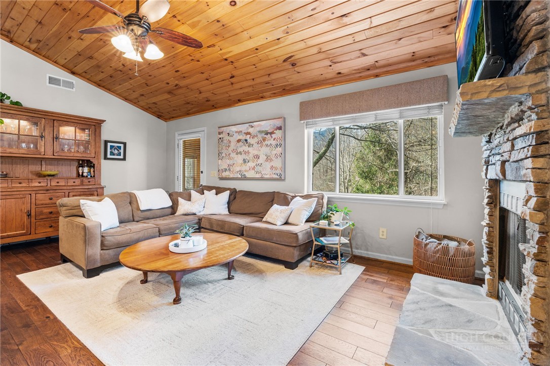 220 Woodwinds Lane Seven Devils, NC 28604 - Photo 7 of 46 a living room with furniture and a large window