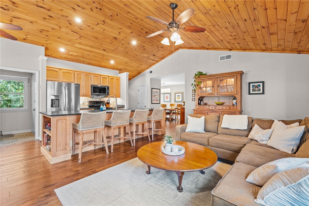 220 Woodwinds Lane Seven Devils, NC 28604 - Photo 8 of 46 a living room with furniture and kitchen view