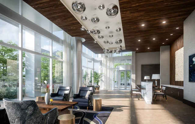 a living room with furniture and a chandelier