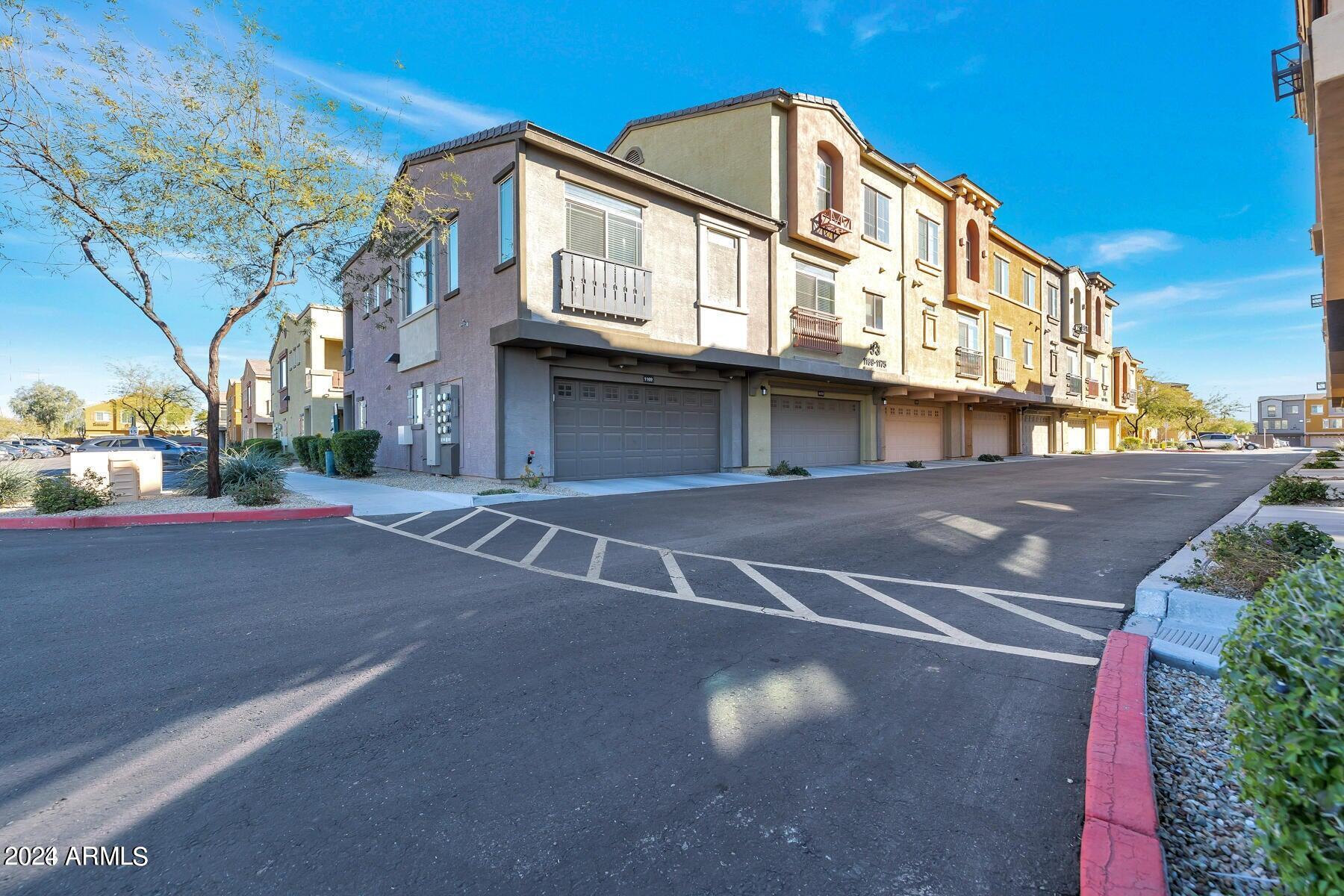 2150 West Alameda Road, Unit 1169 Phoenix, AZ 85085 - Photo 8 of 26 a view of a street with big building
