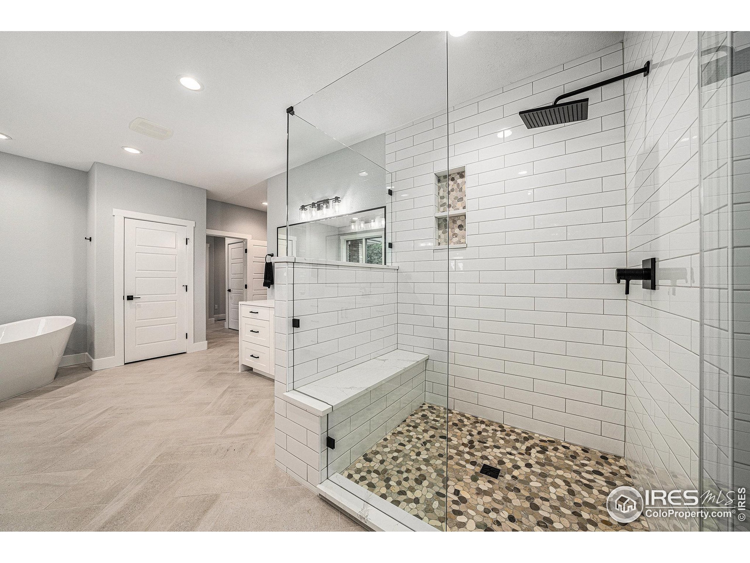 796 Abrams Way Berthoud, CO 80513 - Photo 13 of 40 a bathroom with a sink a toilet and shower