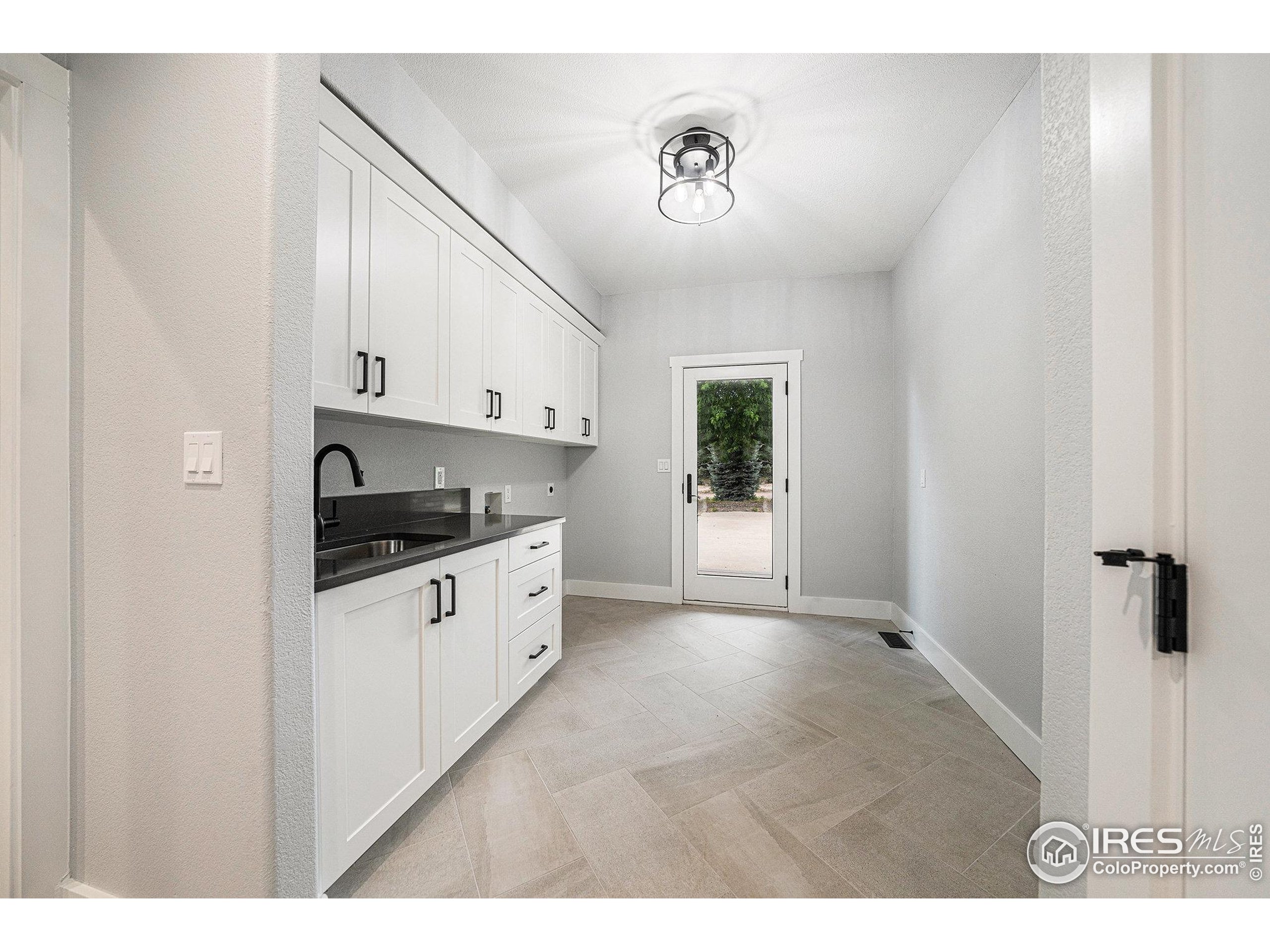 796 Abrams Way Berthoud, CO 80513 - Photo 15 of 40 a kitchen with stainless steel appliances a refrigerator a sink and a stove