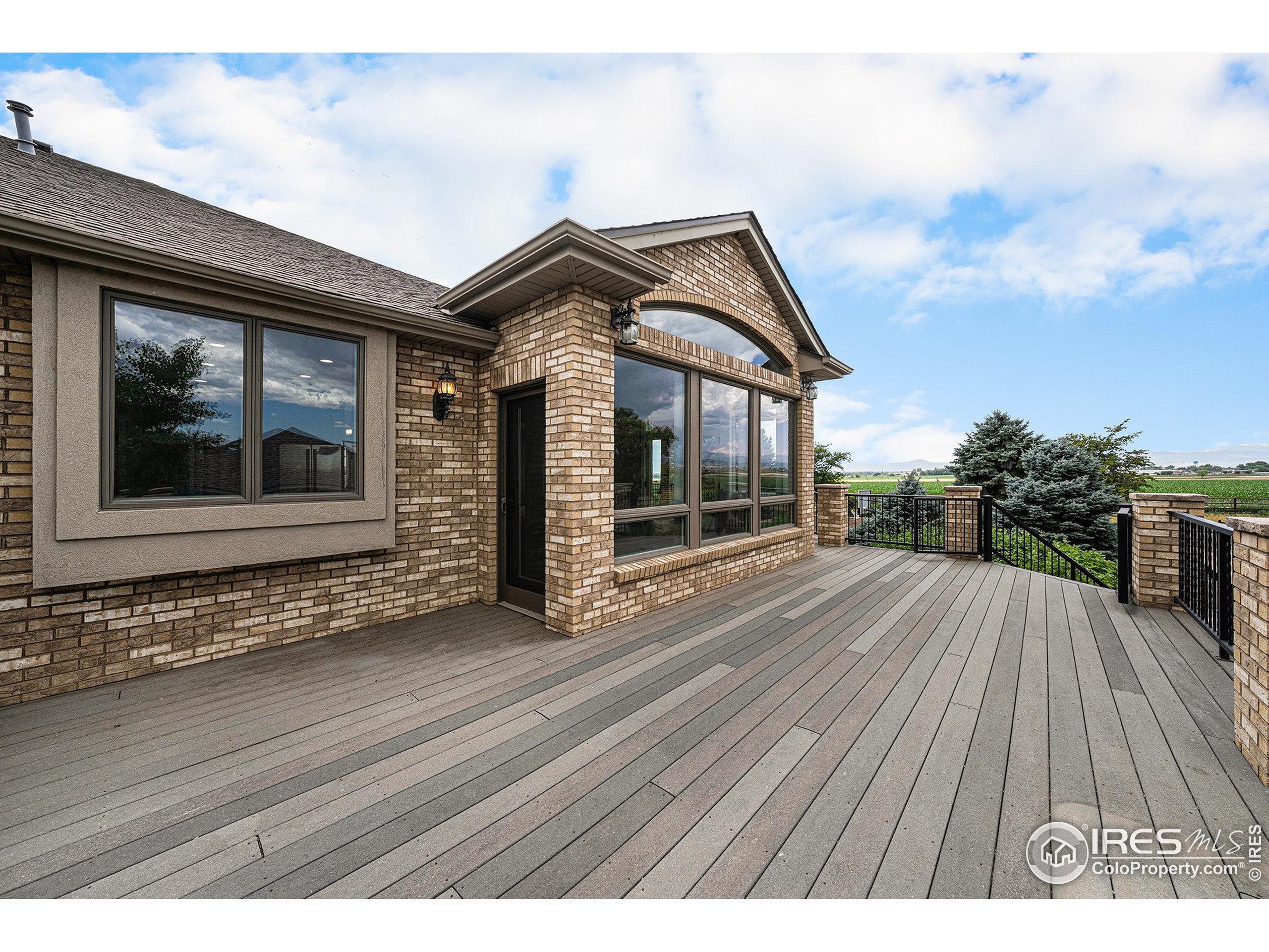 796 Abrams Way Berthoud, CO 80513 - Photo 23 of 40 a view of a house with a wooden deck
