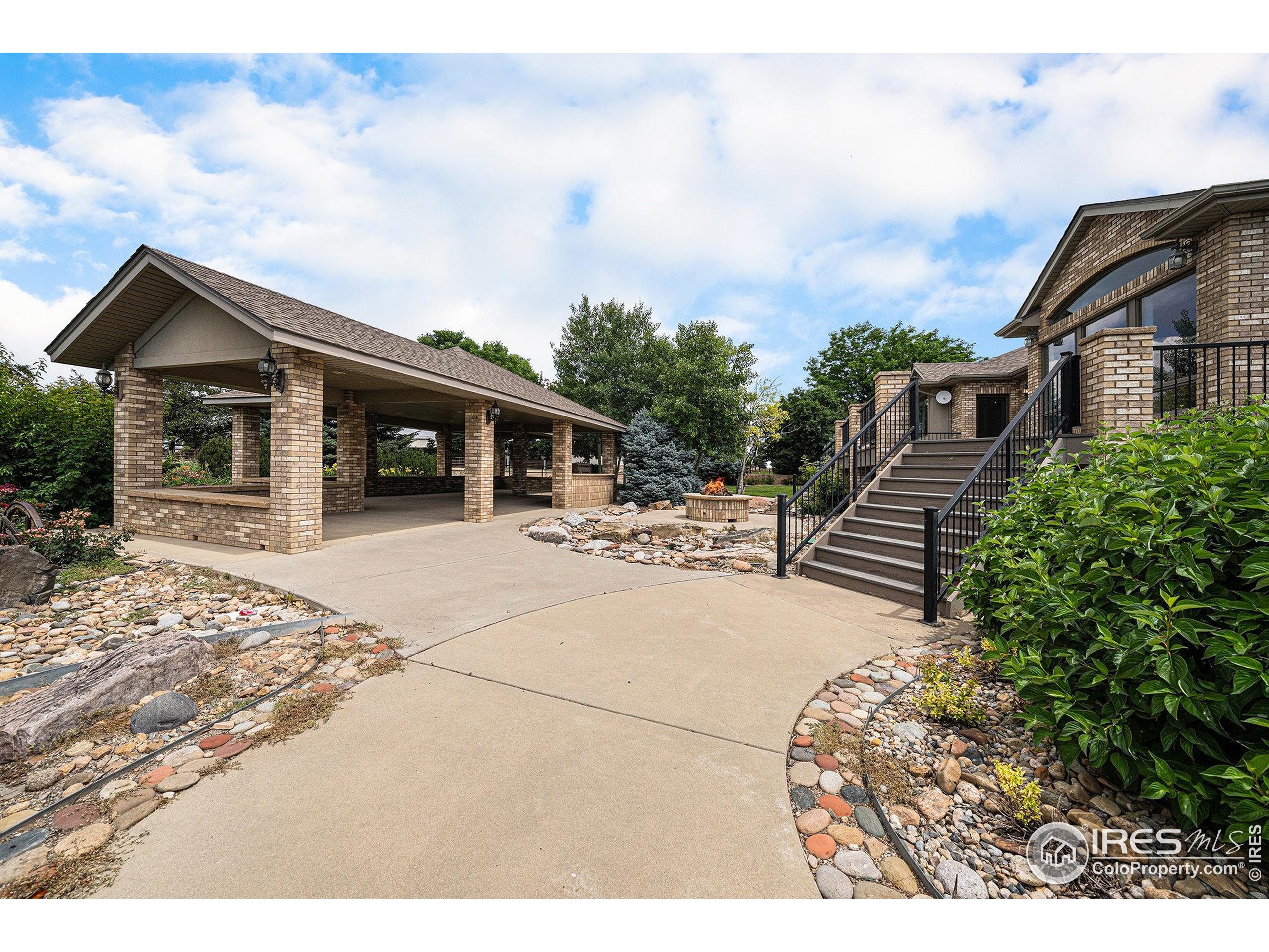 796 Abrams Way Berthoud, CO 80513 - Photo 25 of 40 a backyard of a house with table and chairs