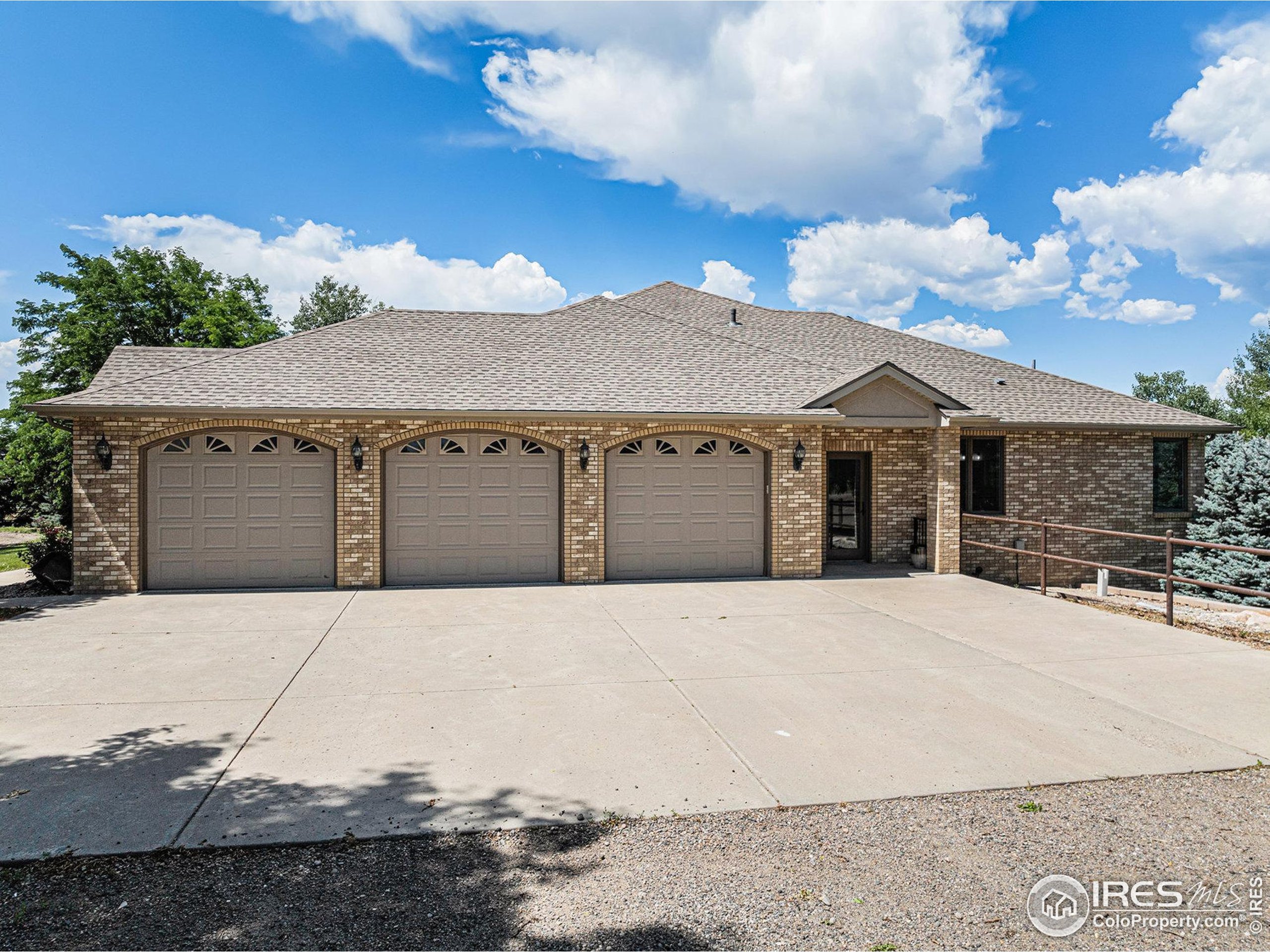 796 Abrams Way Berthoud, CO 80513 - Photo 3 of 40 a front view of a house with yard