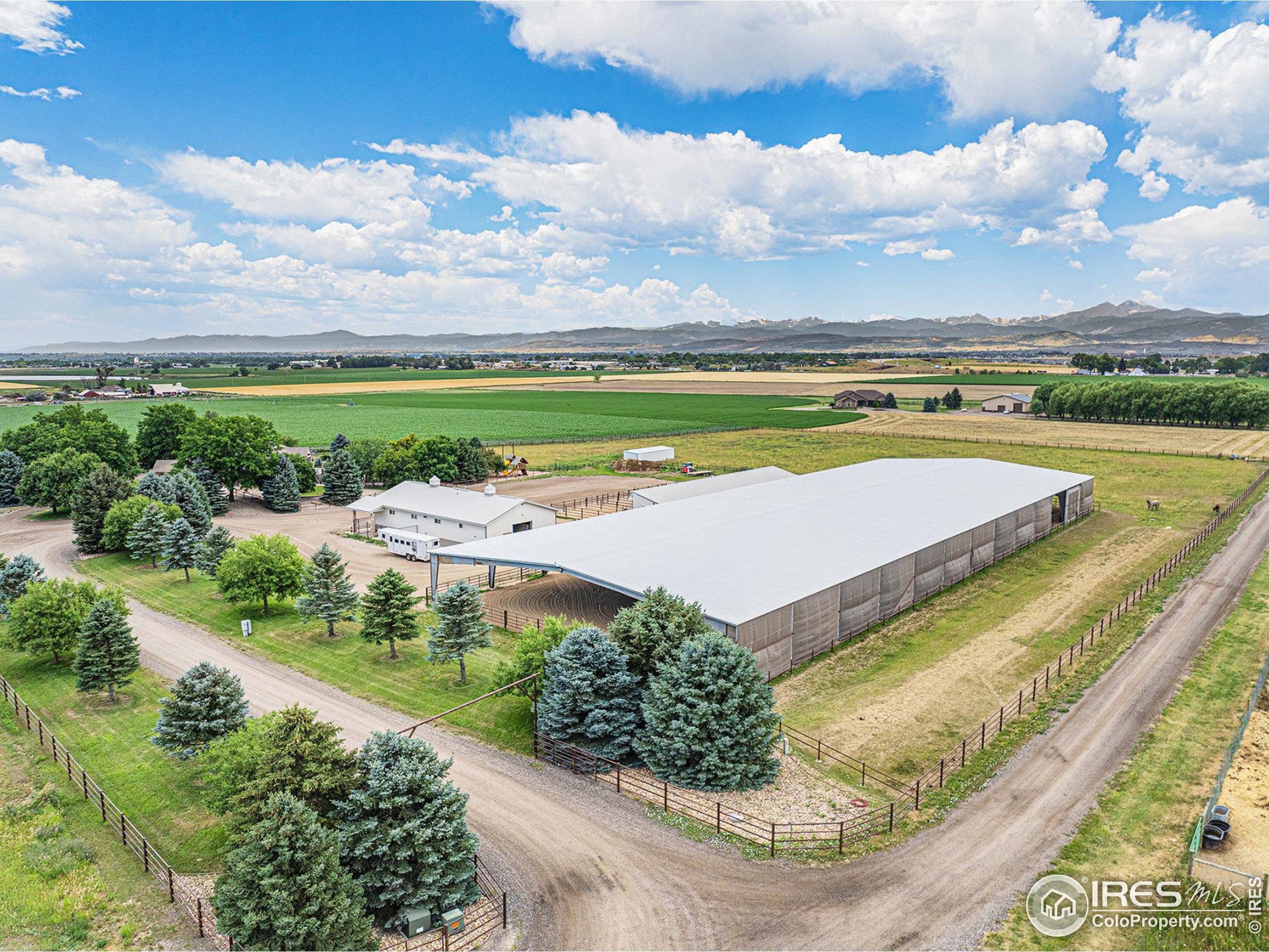 796 Abrams Way Berthoud, CO 80513 - Photo 38 of 40 an aerial view of a house with a garden and lake view