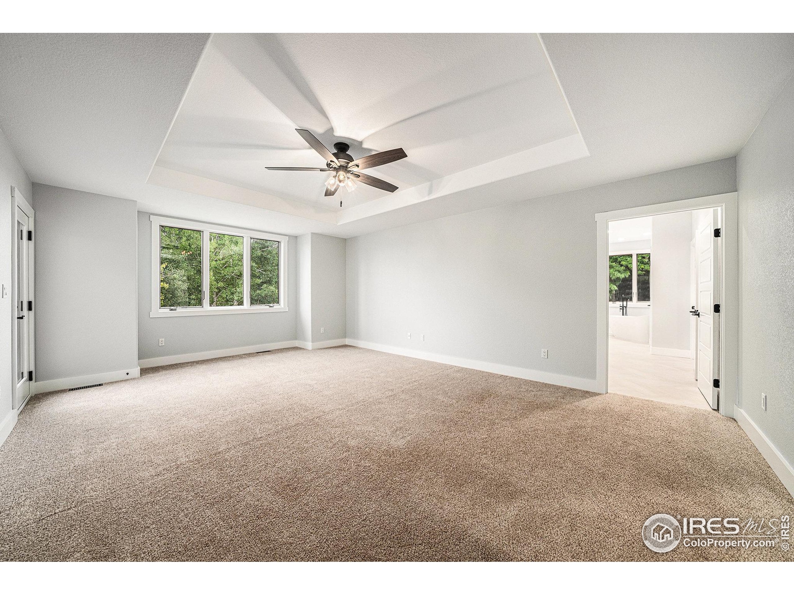 796 Abrams Way Berthoud, CO 80513 - Photo 8 of 40 a view of an empty room with a window