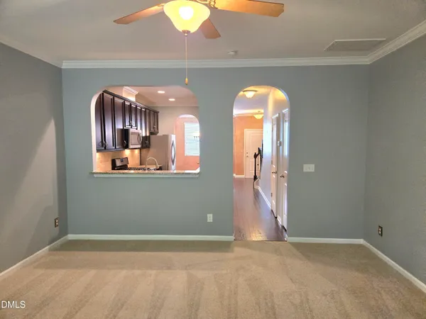 a bathroom with a sink a toilet a mirror and vanity