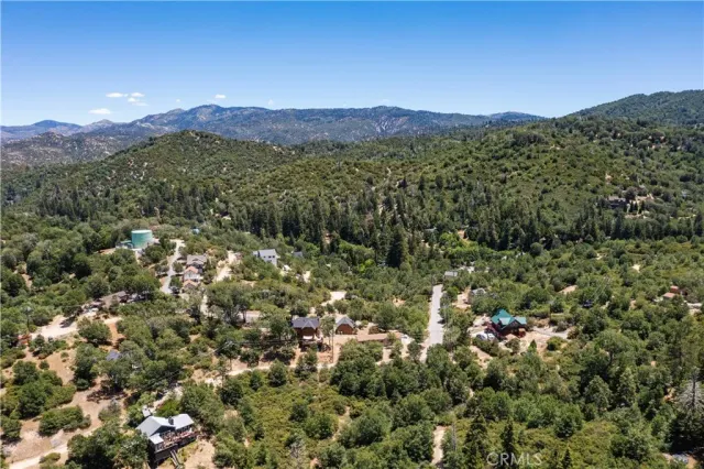 a view of a town with mountains in the background