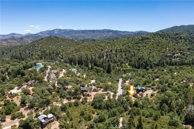 a view of a town with mountains in the background