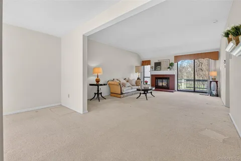 a view of livingroom with furniture and a fireplace
