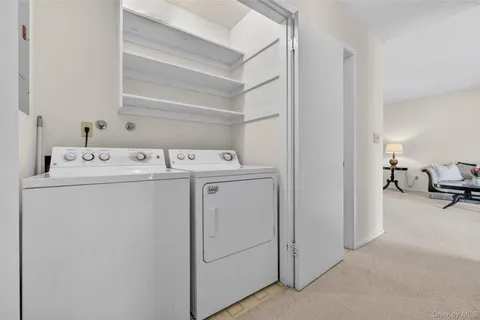 a view of sitting area with furniture and wooden floor