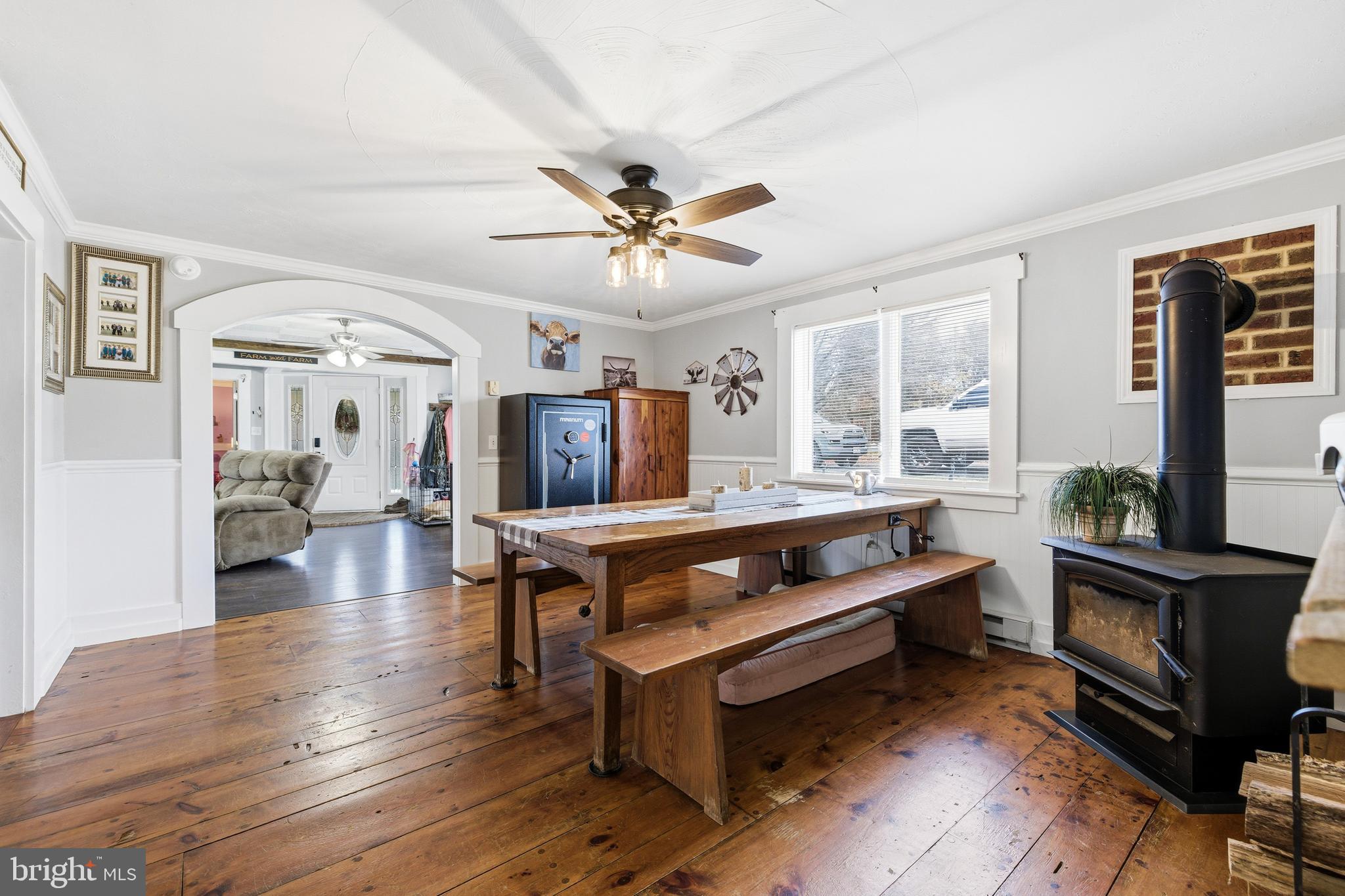 214 Chapel Road Stanley, VA 22851 - Photo 11 of 74 a living room with furniture a fireplace and a table