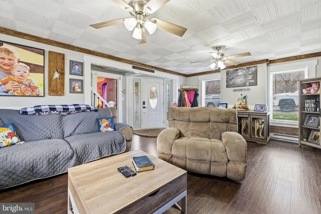 a living room with furniture and a fireplace
