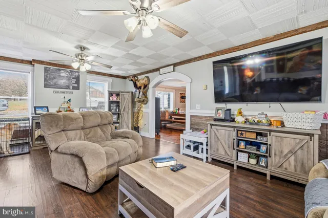 a bedroom with furniture and a chandelier