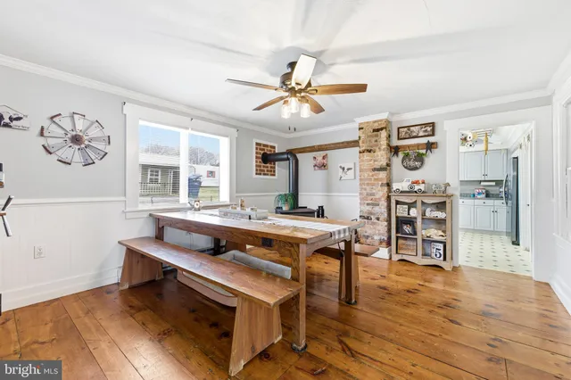 a bedroom with furniture a baby crib and a chandelier