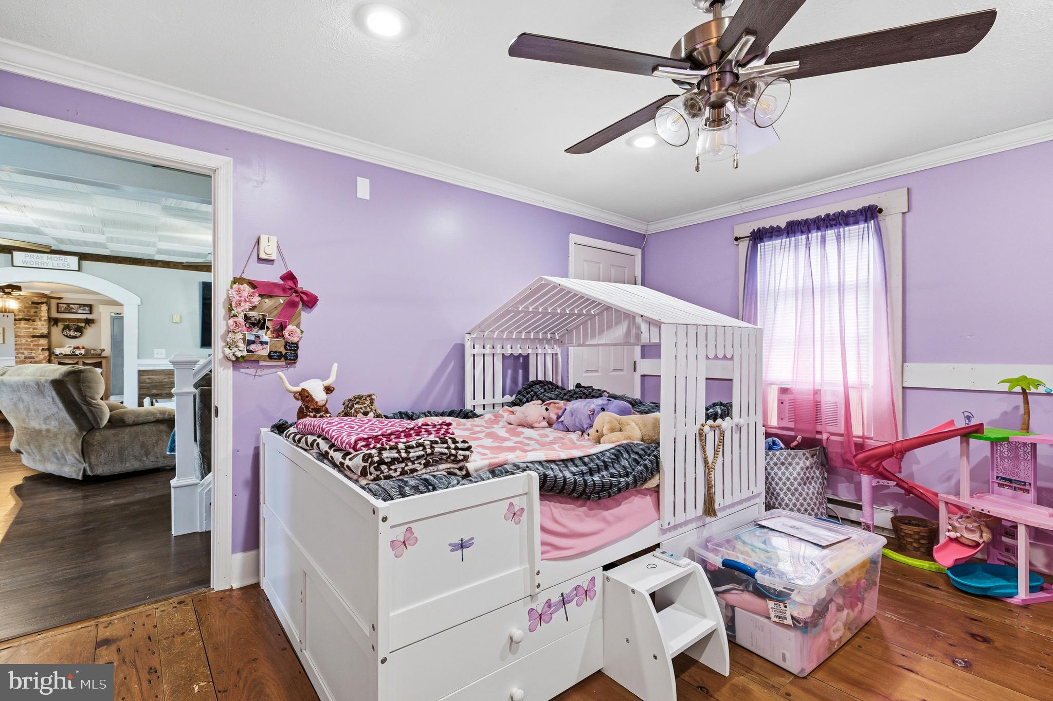 214 Chapel Road Stanley, VA 22851 - Photo 25 of 74 a bedroom with furniture and a chandelier