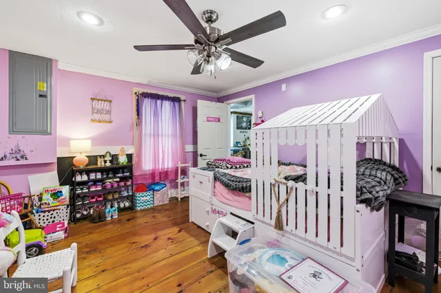 a bedroom with furniture and a window