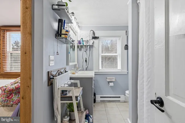 a bedroom with furniture and a wooden floor