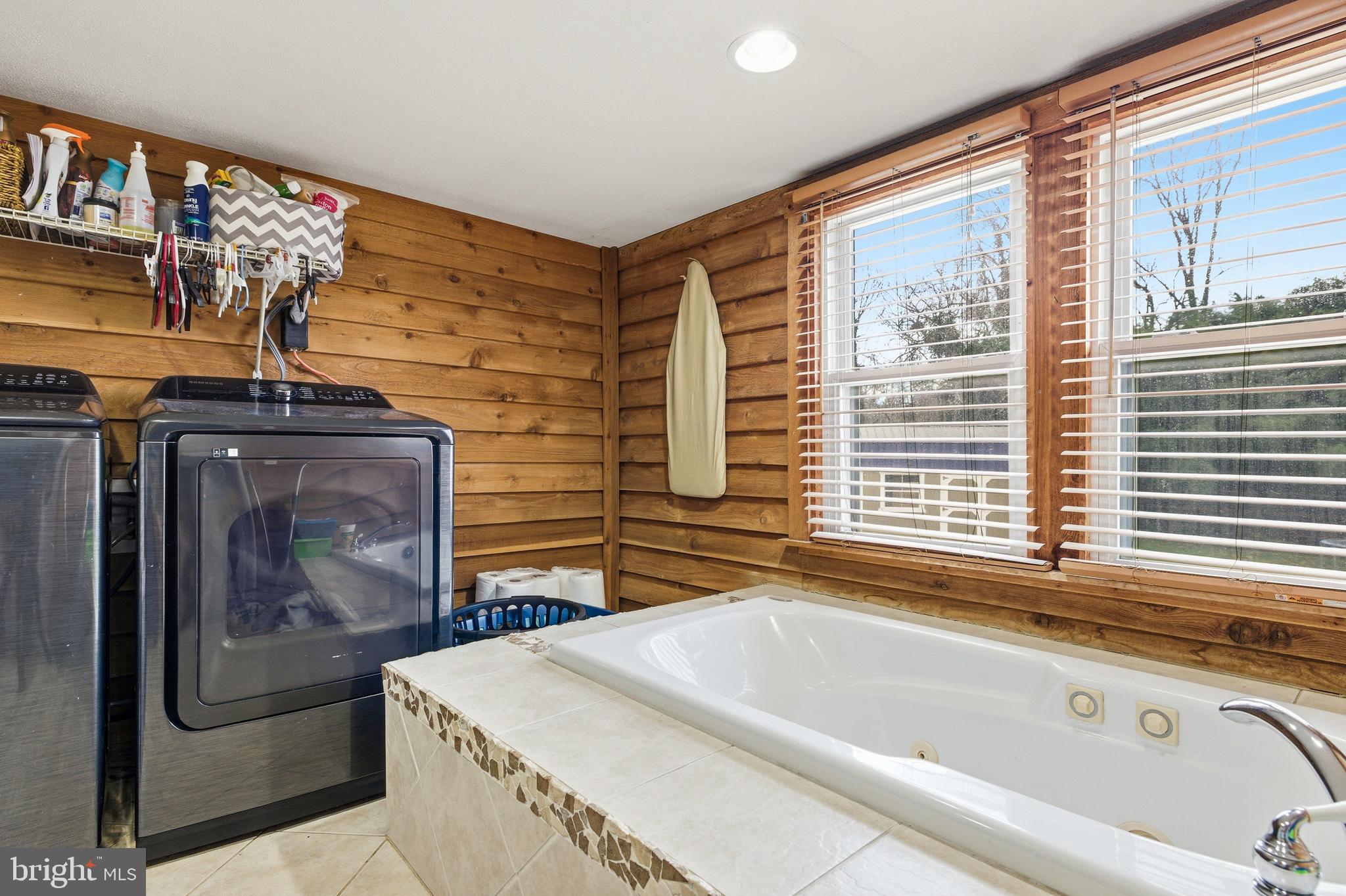 214 Chapel Road Stanley, VA 22851 - Photo 29 of 74 a bathroom with a tub sink and mirror