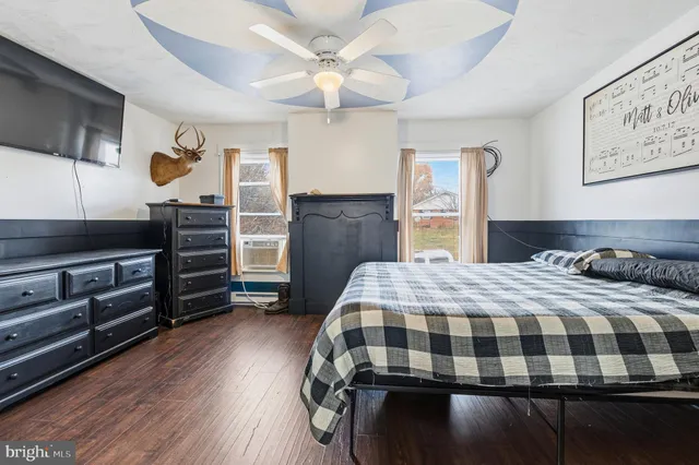 a view of a yard with a house in the background