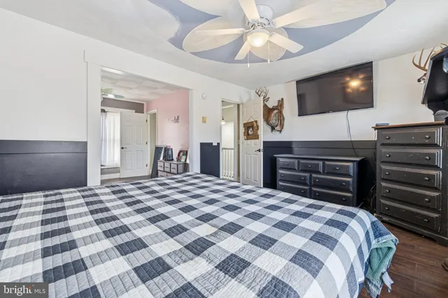 a view of a yard with a house in the background