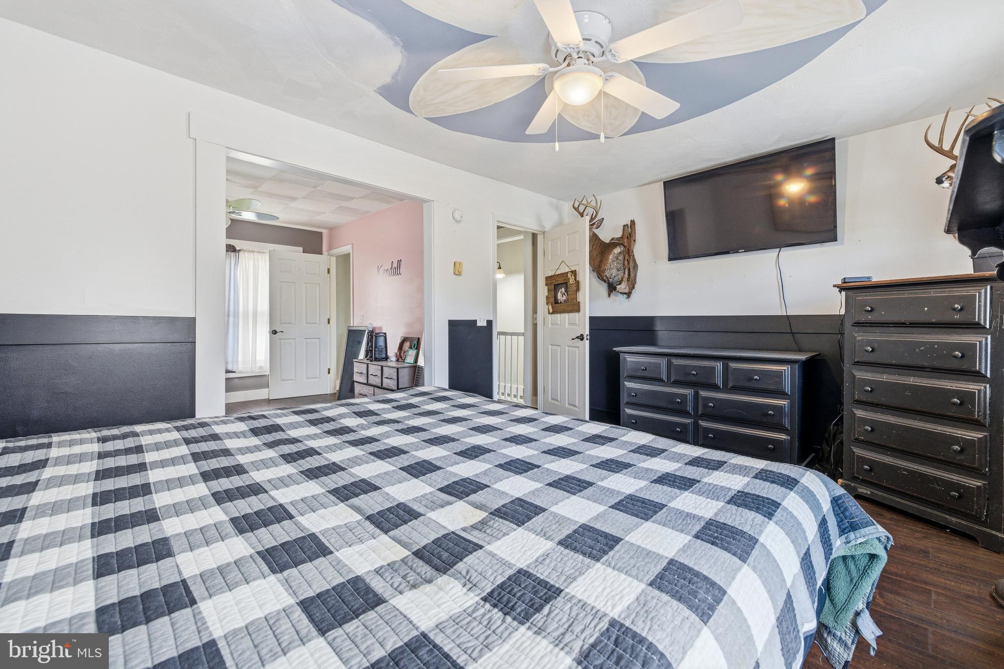 214 Chapel Road Stanley, VA 22851 - Photo 35 of 74 a bedroom with a bed and a flat screen tv