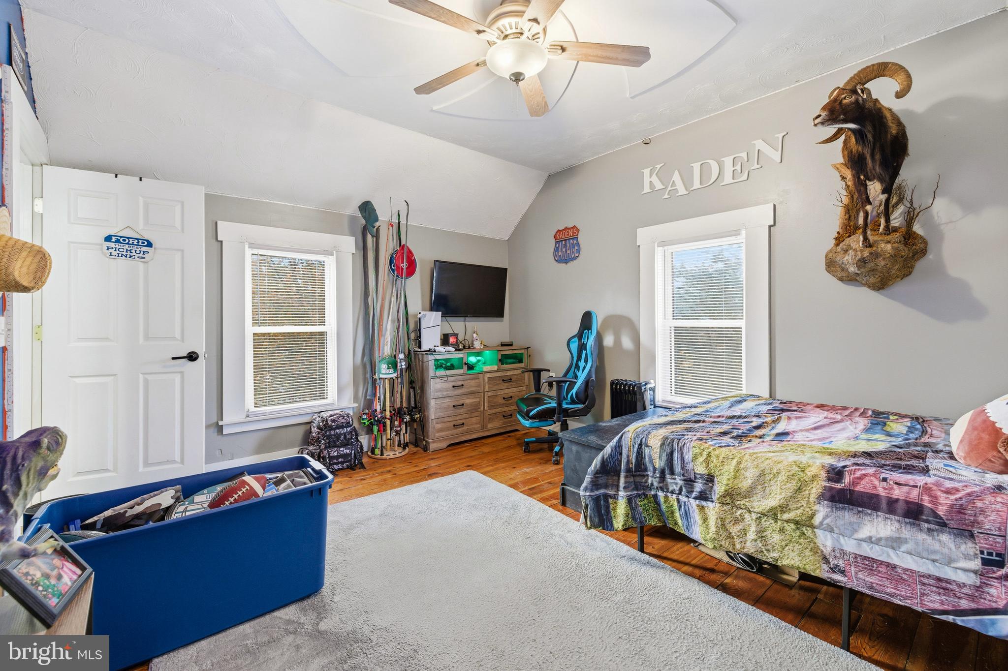 214 Chapel Road Stanley, VA 22851 - Photo 39 of 74 a bedroom with bed and a chandelier
