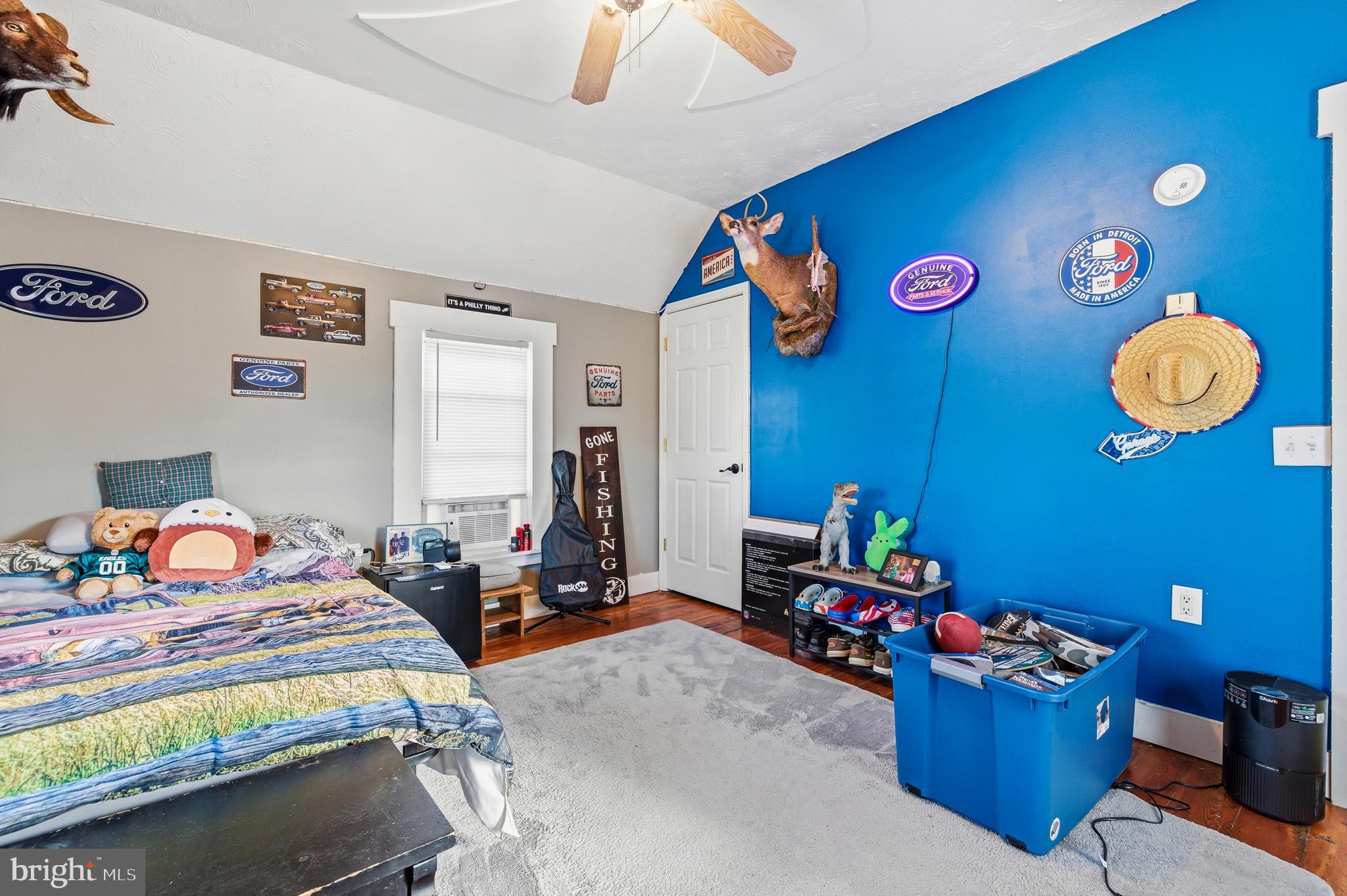 214 Chapel Road Stanley, VA 22851 - Photo 40 of 74 a bedroom with a bed and a chandelier