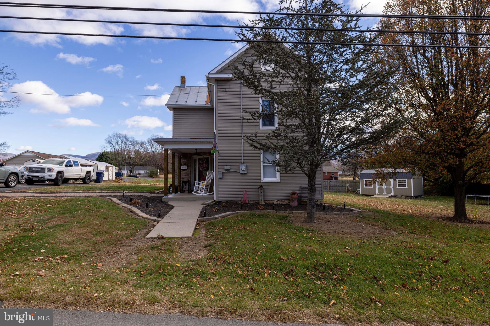 214 Chapel Road Stanley, VA 22851 - Photo 44 of 74 a view of a yard with a house in the background