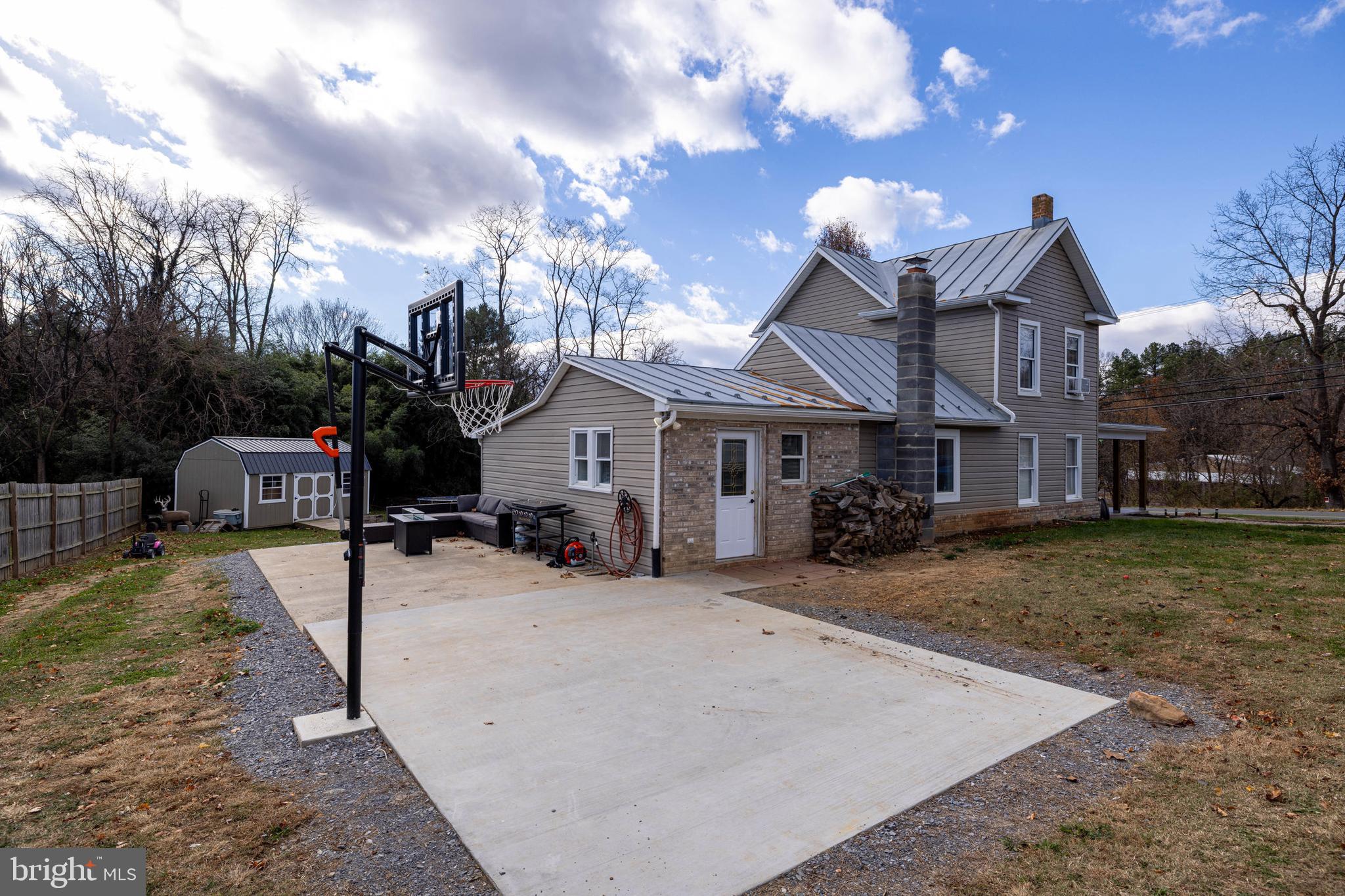214 Chapel Road Stanley, VA 22851 - Photo 46 of 74 a view of a house with a yard patio and fire pit