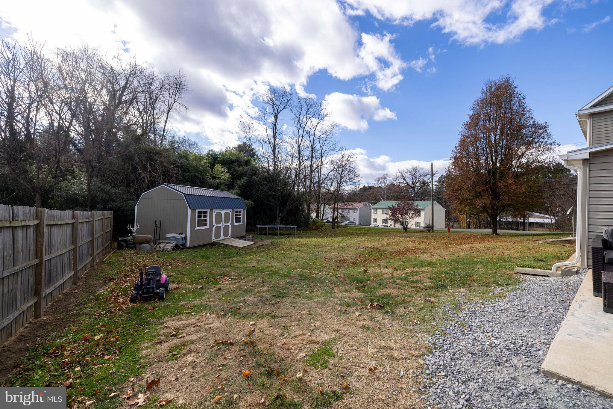 214 Chapel Road Stanley, VA 22851 - Photo 49 of 74 a view of a yard with a house in the background