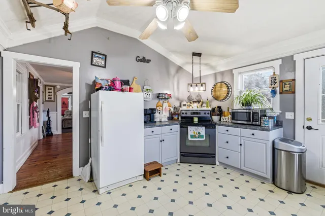 a kitchen with sink cabinets and window