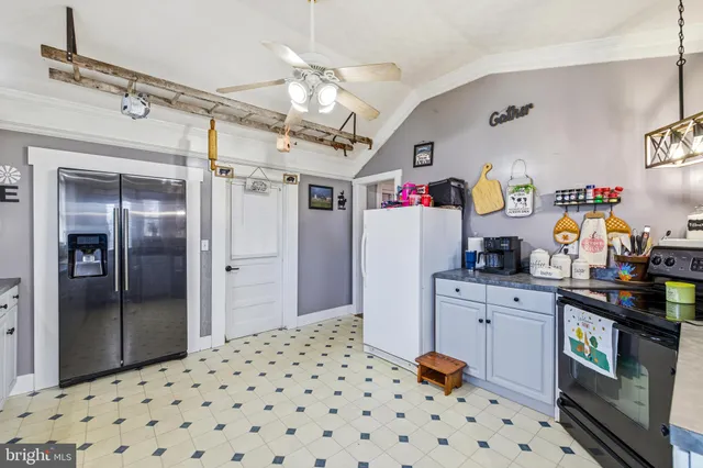 a kitchen with a window and cabinets