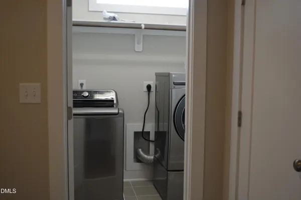 a white toilet sitting next to a sink