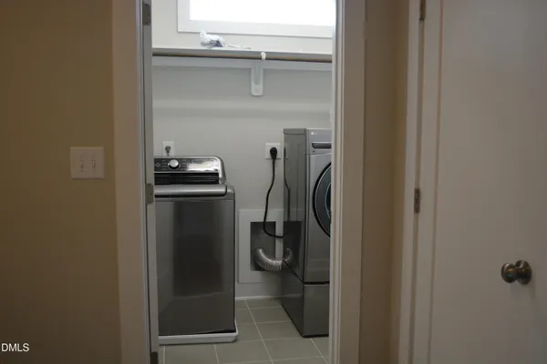 a bathroom with a shower and a sink
