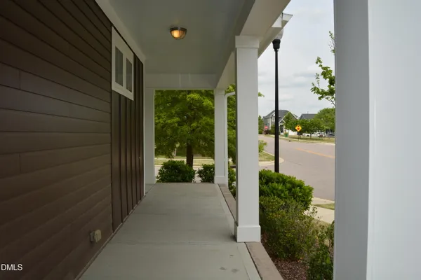 a view of a brick house with a yard