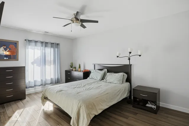 a bedroom with a bed and a table