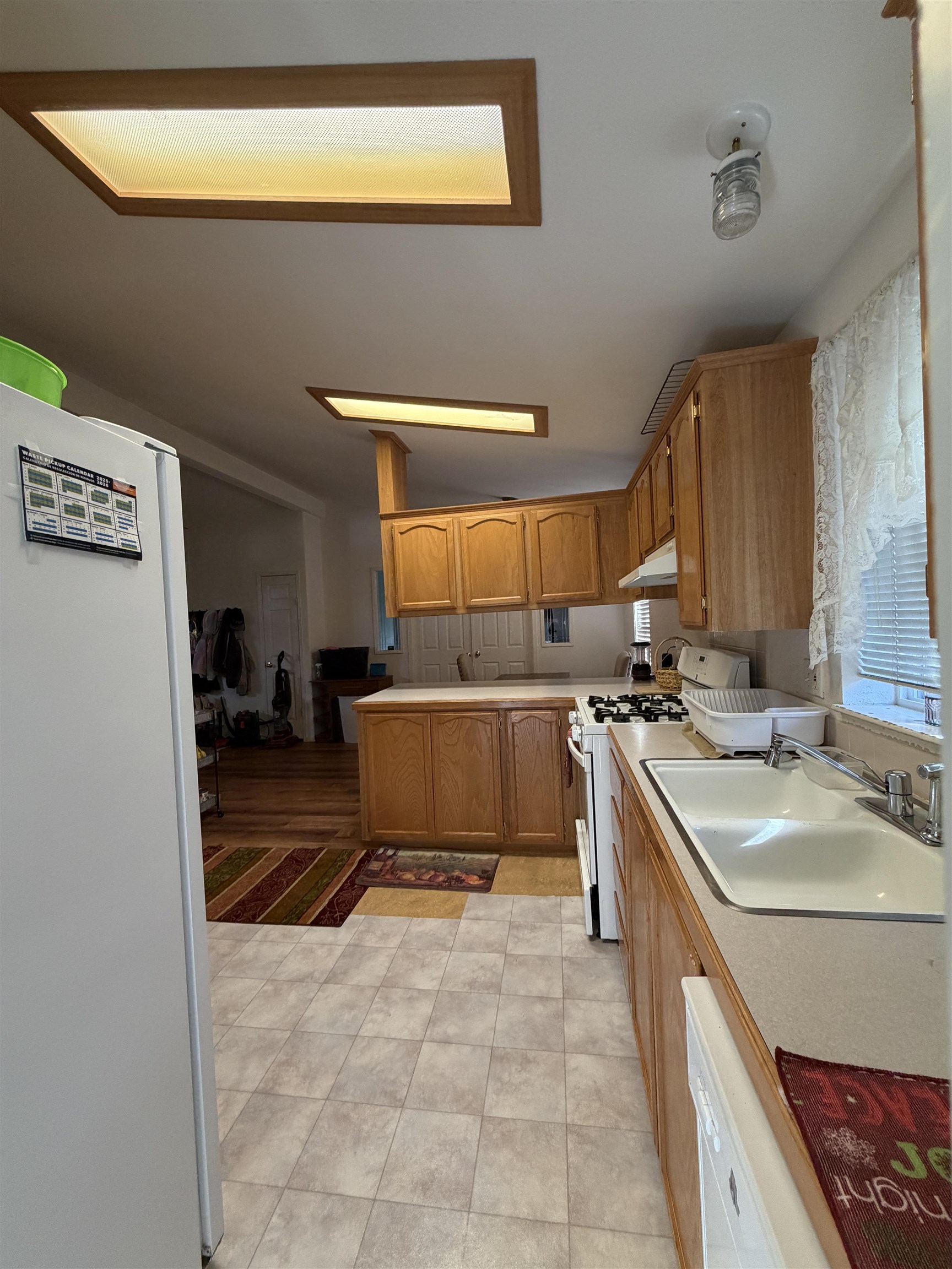 10100 Pioneer Trail, Unit 76 Reno, NV 89503 - Photo 13 of 22 a kitchen with a sink and a stove top oven