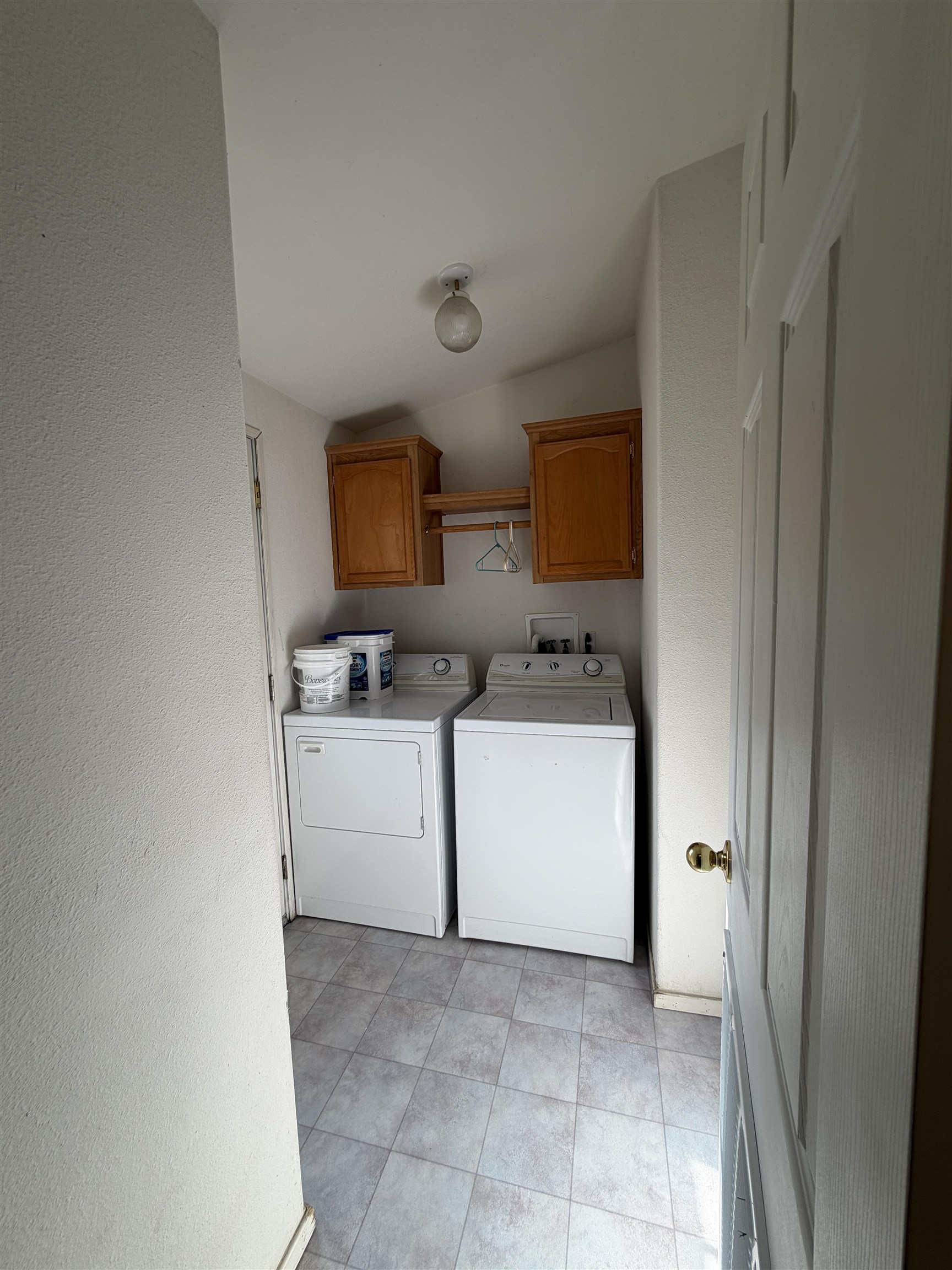 10100 Pioneer Trail, Unit 76 Reno, NV 89503 - Photo 16 of 22 a utility room with cabinets washer and dryer