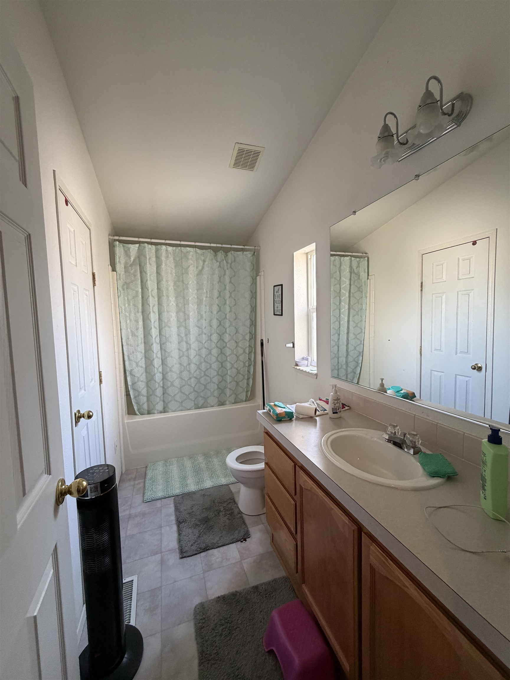 10100 Pioneer Trail, Unit 76 Reno, NV 89503 - Photo 19 of 22 a spacious bathroom with a double vanity sink a large mirror and shower