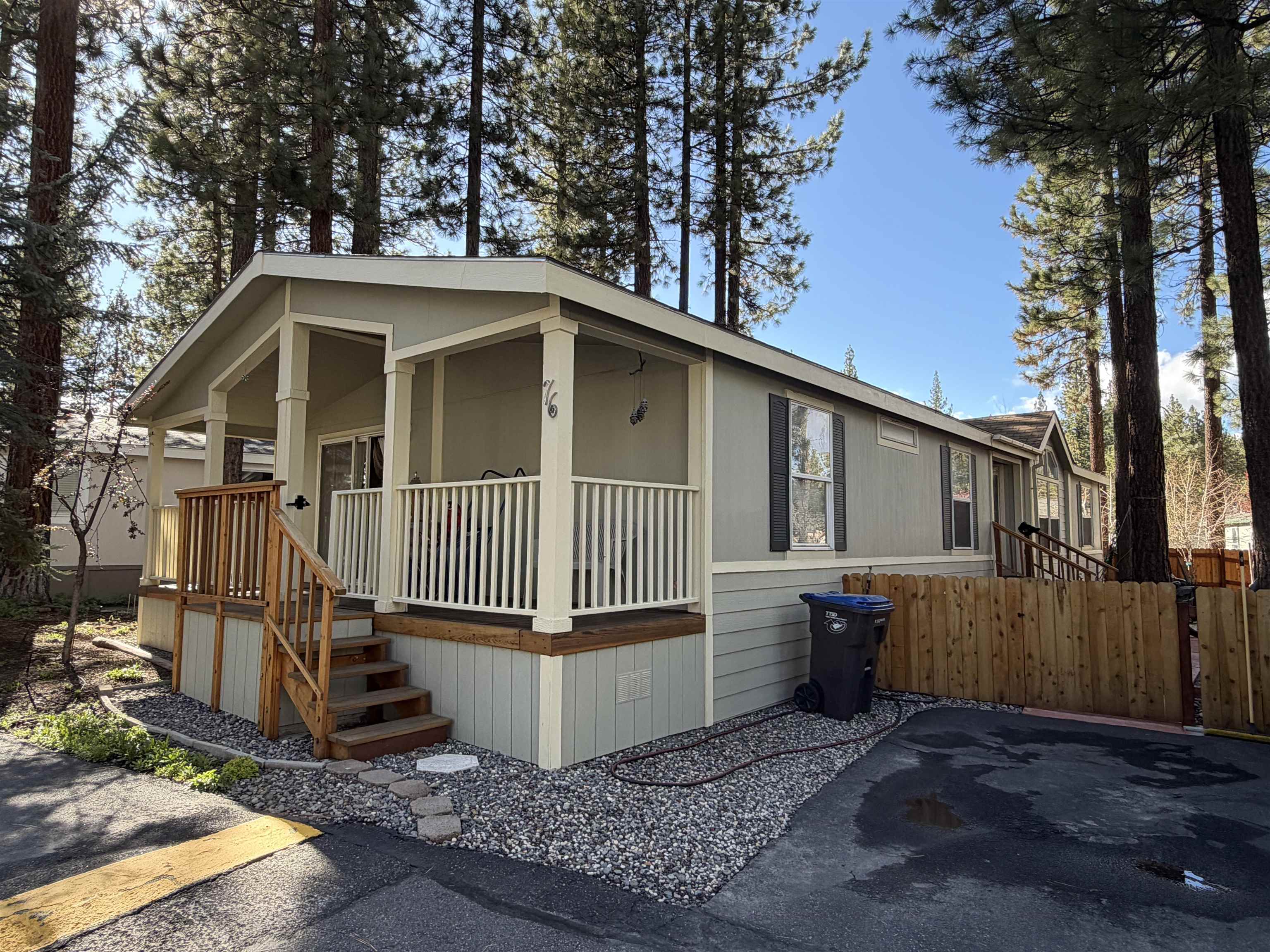 10100 Pioneer Trail, Unit 76 Reno, NV 89503 - Photo 2 of 22 a view of a small house with wooden deck front of house
