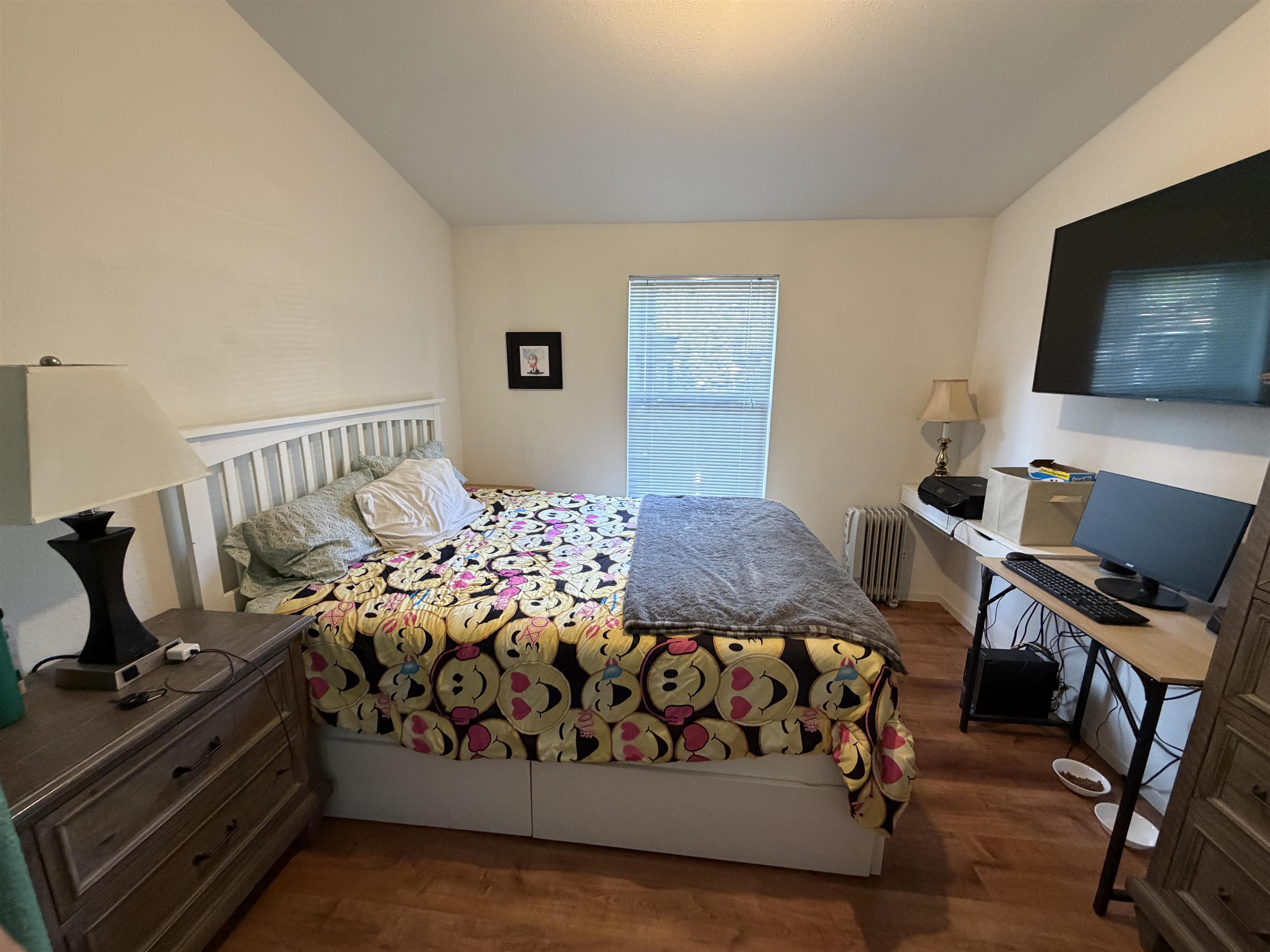 10100 Pioneer Trail, Unit 76 Reno, NV 89503 - Photo 21 of 22 a bedroom with a bed and flat screen tv