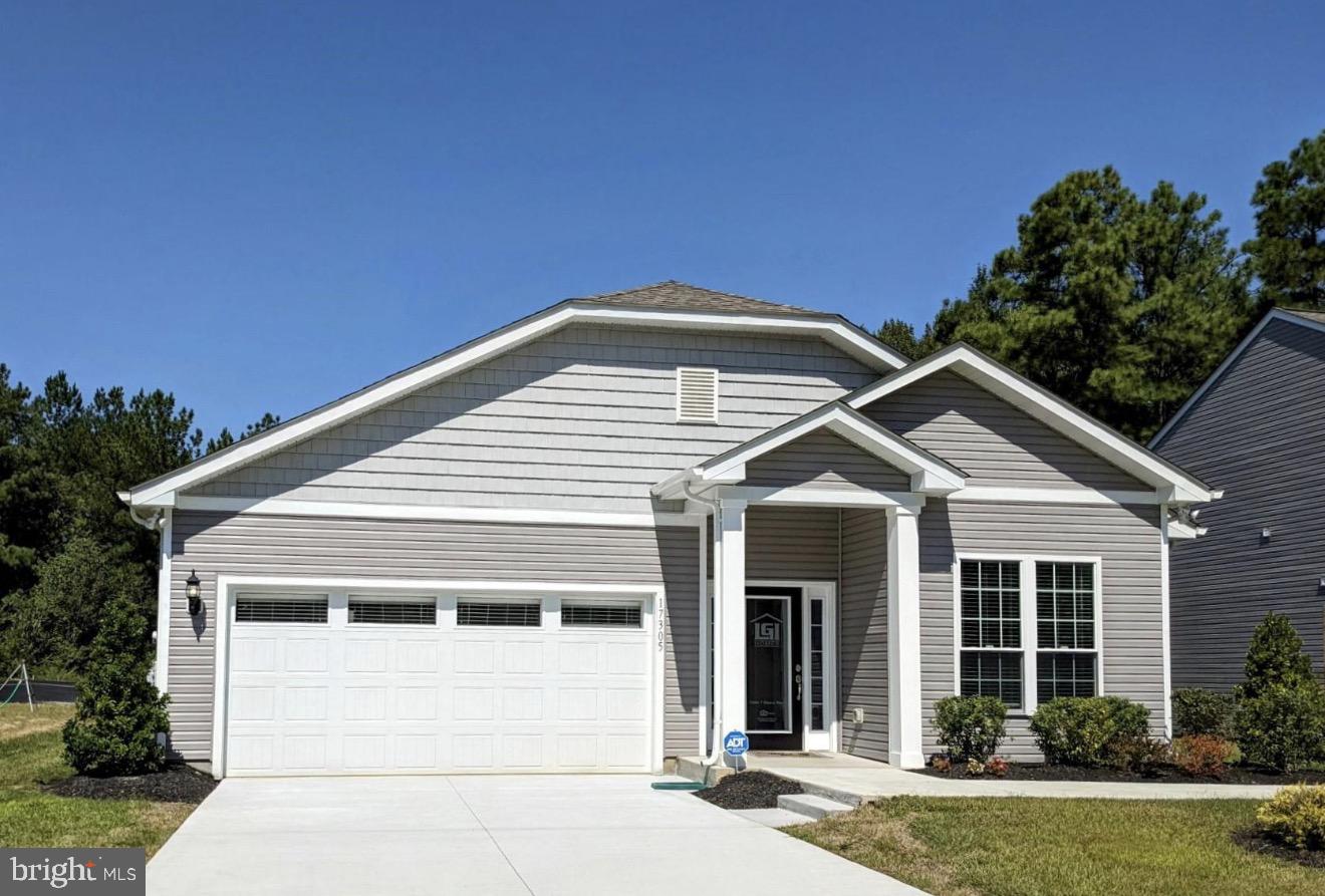 17305 George Ruffin Road Milford, VA 22514 - Photo 1 of 6 a front view of a house with a yard