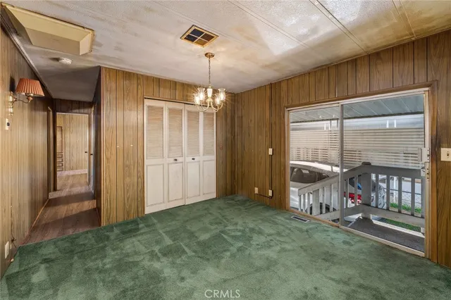 a bathroom with a glass door shower and a sink