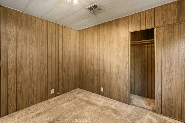 a view of a hallway with a wooden door